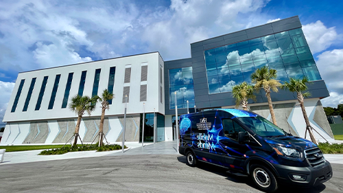 new building with van in front